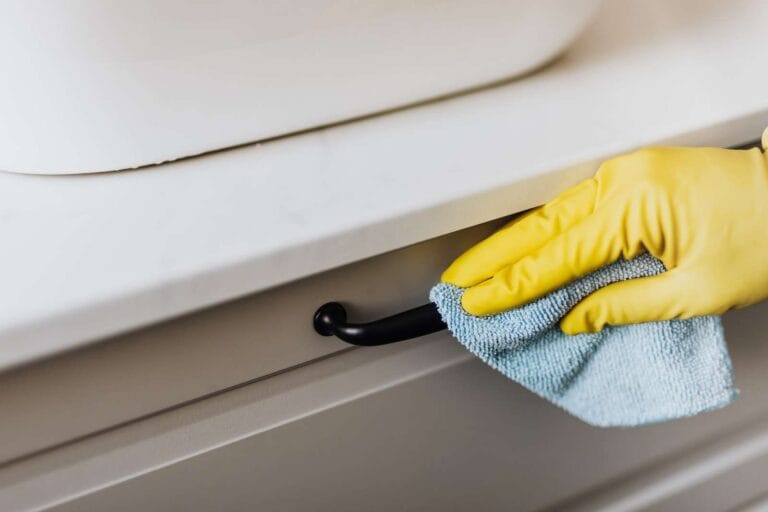 How To Clean Dog Poop From Hardwood Floors 13 House cleaner cleaning handle of cabinet with microfiber cloth