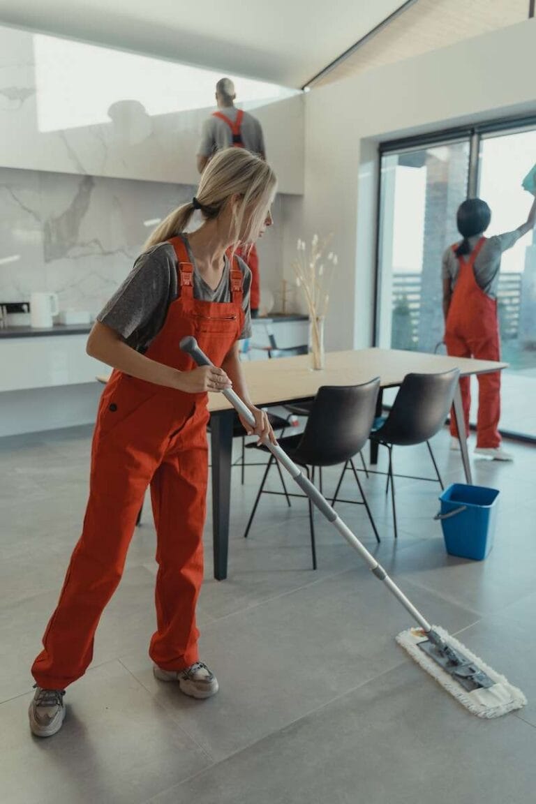 cleaning team members cleaning an apartment