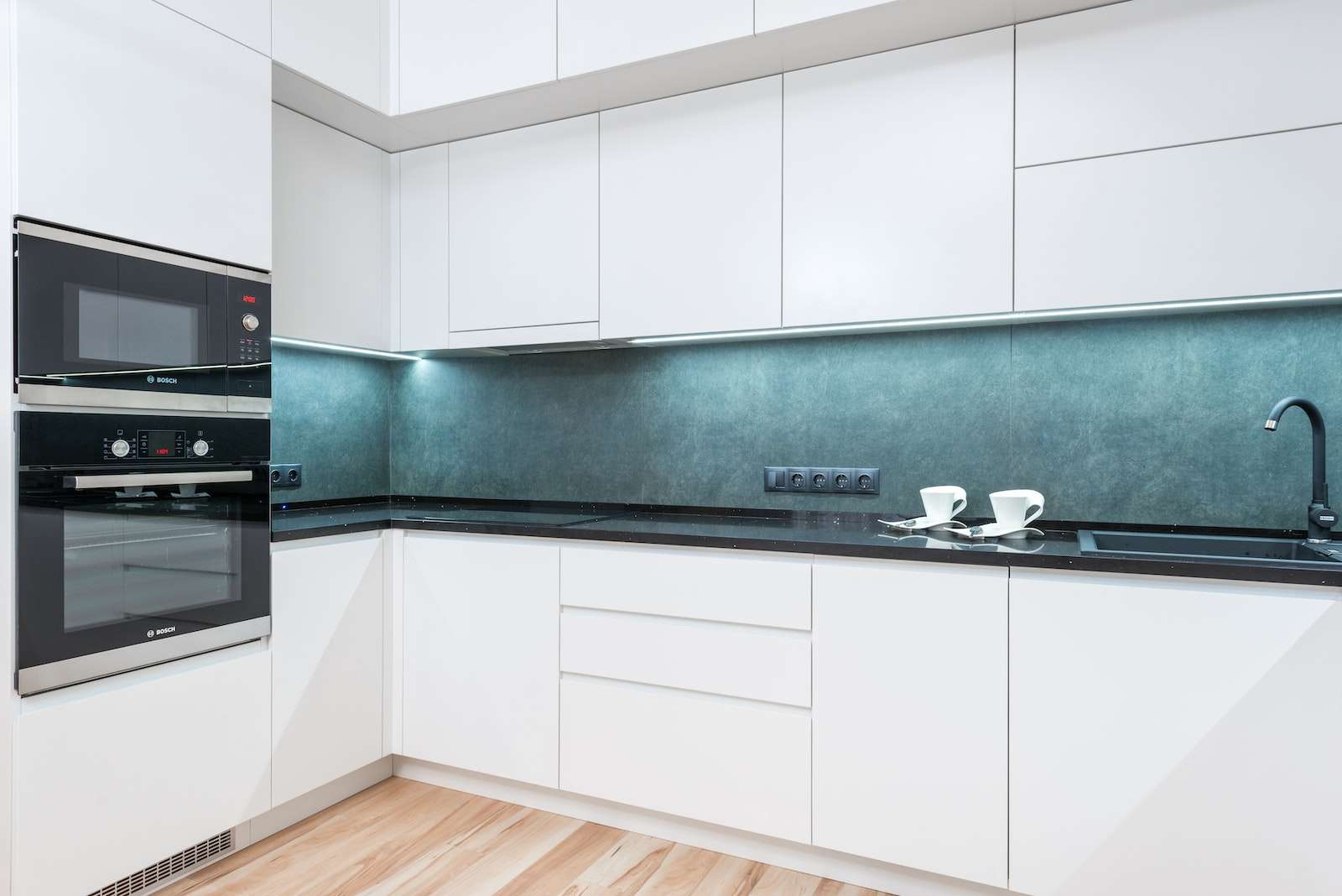 How to Safely Remove Bleach Stains from Aluminum 1 White minimalist kitchen with blue backsplash