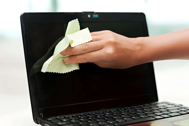 How to Clean a Laptop Screen and Remove Smudges Fast 9 person cleaning a laptop screen