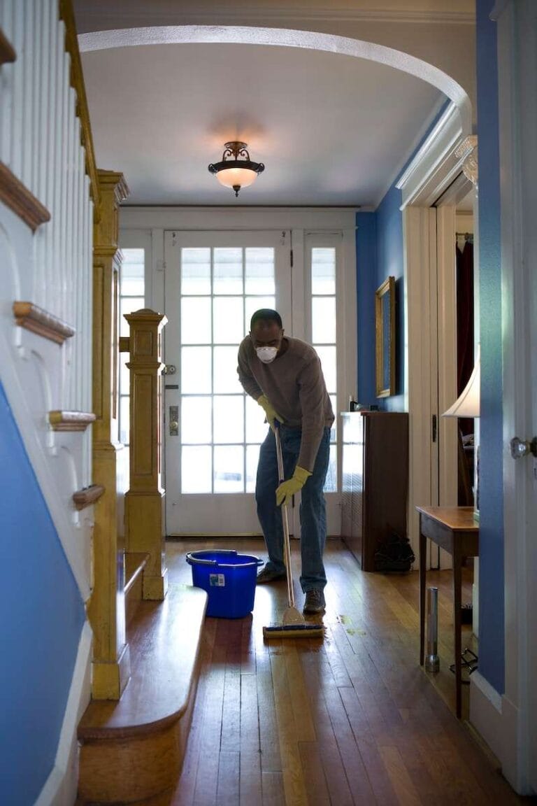 How to Wash Your Washing Machine: Easy Step-by-Step Guide 3 man cleaning the floor using mop