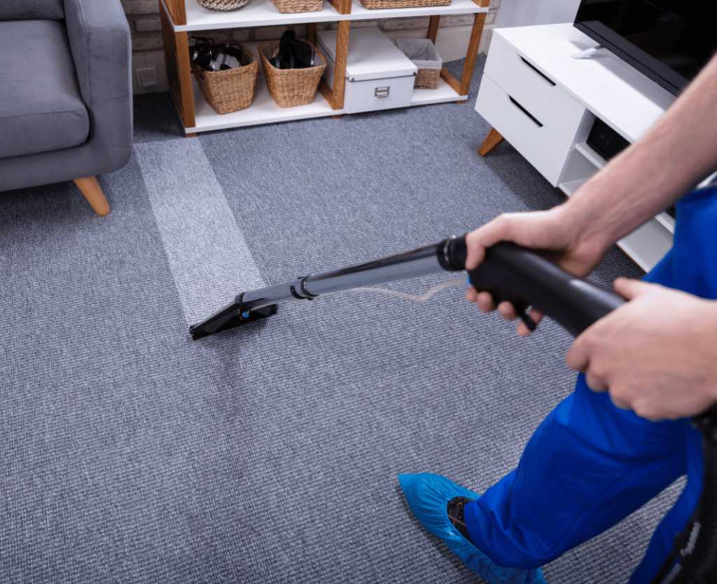 Rug Cleaning 5 a professional cleaner cleaning the living room carpet