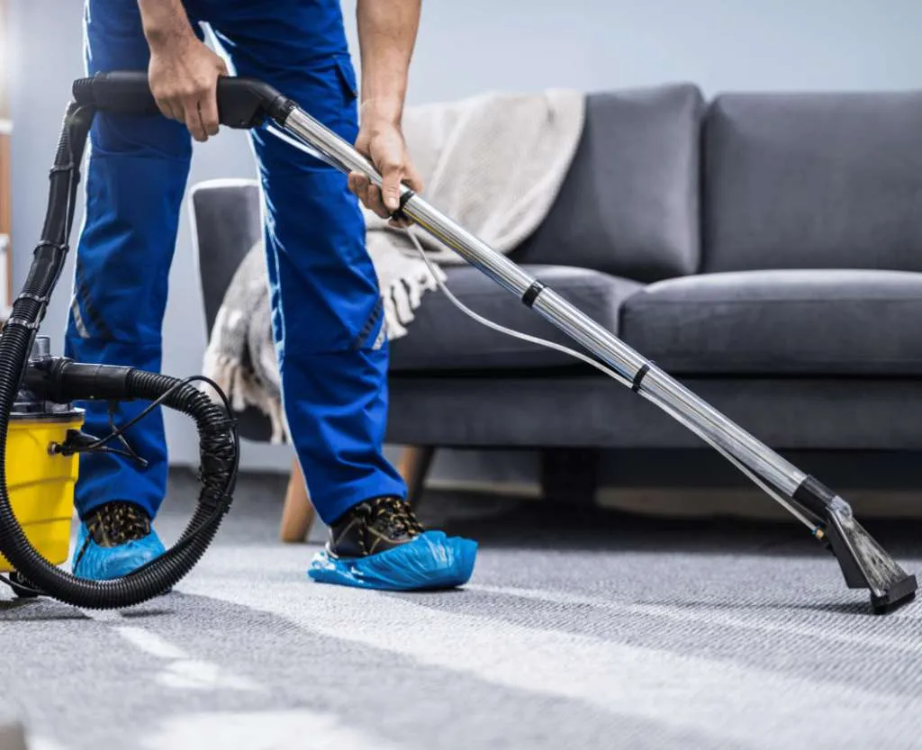 Rug Cleaning 2 a professional cleaner cleaning the living room carpet